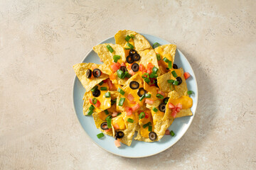 A top down view of a plate of dairy-free nachos.
