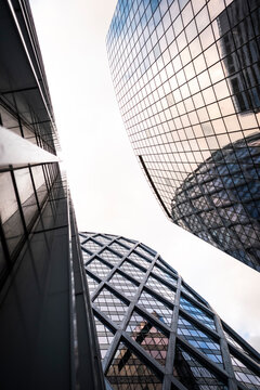 Modern architecture skyscraper of glass with perspective lines for corporate business finance office towers in Paris La Defense France under overcast sky