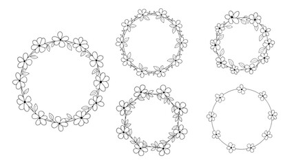 Obraz premium Collection of five beautiful hand drawn floral wreaths and frames made with simple flowers and leaves in a black outline style.
