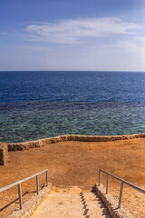 Steps Leading Down to the Clear Blue red sea