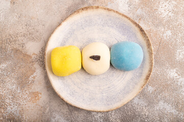 Japanese Mochi Cakes on brown concrete, top view, flat lay, close up