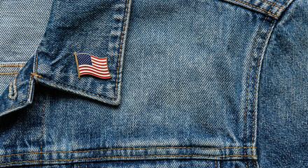 American flag lapel pin proudly displayed on a classic denim jacket.