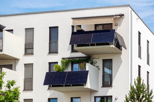 Modern Balcony with Solar Panels Station of Modern Facade Residential Apartment Building in Eco City. 