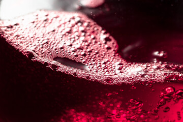 Red wine abstract splashing in glass.