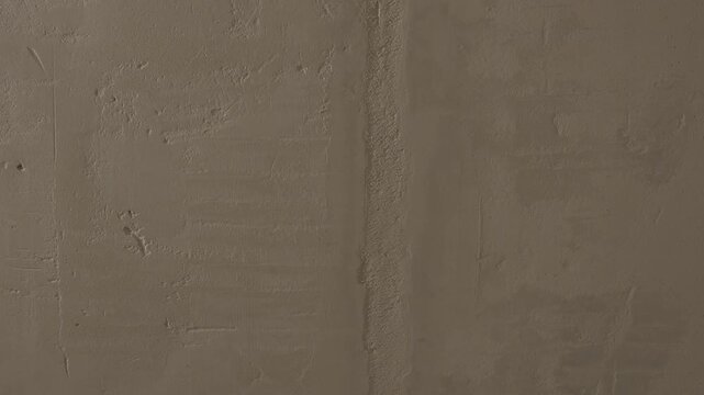 Rough concrete wall texture with gradual changes in surface detail and color across three sequential frames. Rough concrete wall texture