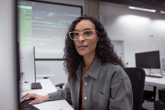 Focused woman testing AI machine learning