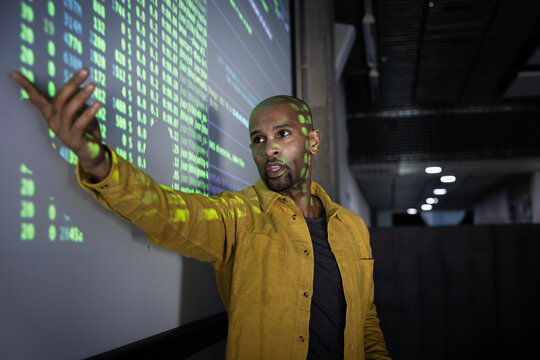 African American male coder presenting at a tech conference