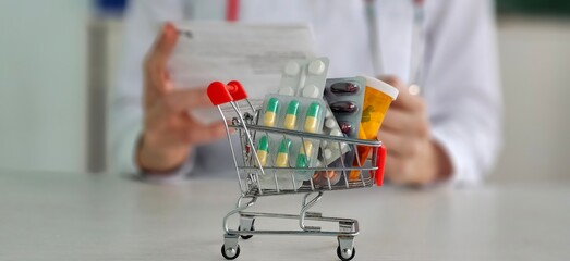 A basket of medicines and a doctor preparing a prescription at the pharmacy.