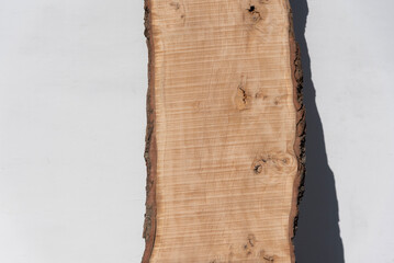 Beautiful Ash wood slabs with natural live edges that retain sections of their original bark for a rustic.