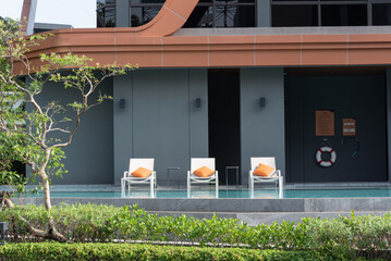 luxury swimming pool and Modern furniture on rooftop garden.