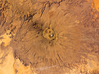 Satellite View Of Emi Koussi Volcano In Chad Sahara Desert With Large Caldera. Elements of this image furnished by NASA. © gizemg