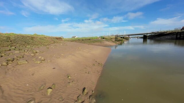 Fast FPV Drone View Over Foss Dyke River Drain in UK, Cinematic Low Altitude Flight Near Bridge Piers and Pumping Station Sluice Gates 4K