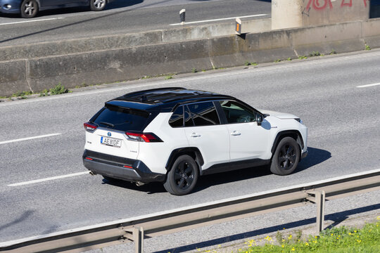 Toyota rav4 hybrid suv driving on highway
