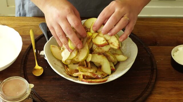 Woman makes an apple pie
