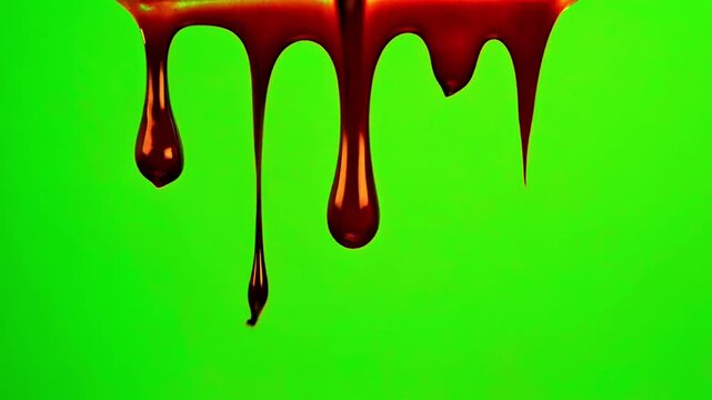 Realistic dark red blood dripping from top continuously on green screen.
