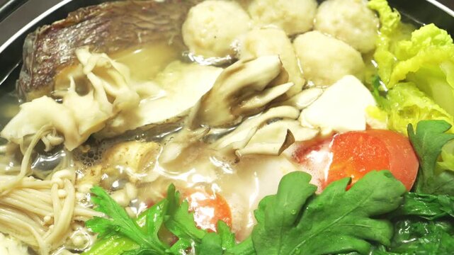 Japanese Hot Pot Cooking in Winter &ndash; Steaming Nabemono with Vegetables and Fish Close-Up