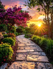 Obraz premium Winding stone path through a colorful garden at sunset