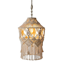 Macrame hanging lantern with warm light against black background warm glow white