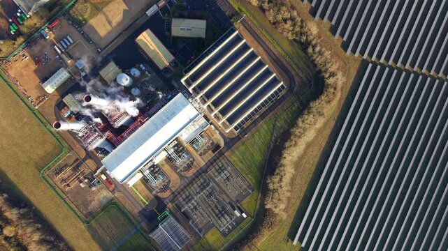 Aerial drone view of the Sutton Bridge power complex in Lincolnshire, UK, featuring its gas-fired CCGT facility and utility-scale solar farm.