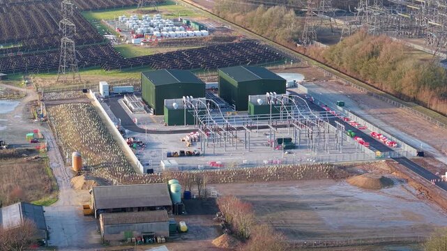 Close up aerial drone shot of synchronous condensers at Walpole substation UK providing grid stability and inertia for renewable energy distribution.
