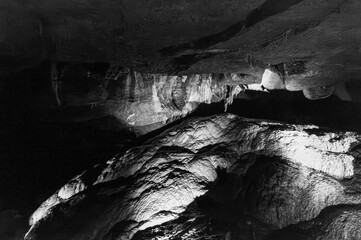 A dark cave with a light shining on it
