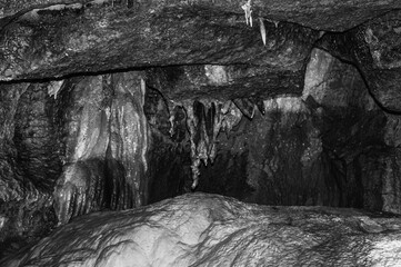 A cave with a large rock in the middle