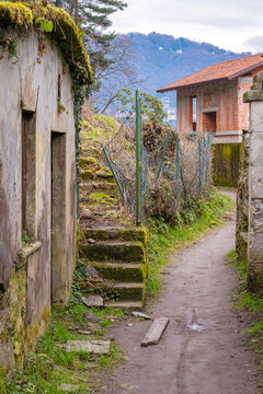 Old abandoned houses along the shoreline of Orta Lake, during wintertime. Is a glacial origin lake in northern Italy, Piedmont region, with San Giulio island, home of nuns cloister and UNESCO Site.