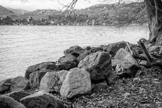 Panorama of the Lake Orta winter waters and shoreline, with the alps in the background. Is a glacial origin lake in northern Italy, Piedmont region, famous for San Giulio island, home of nuns cloister
