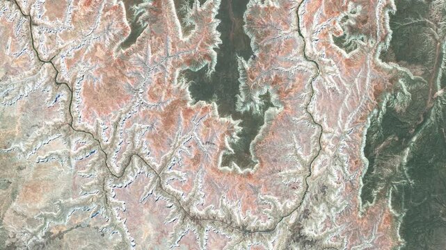 High-resolution 4K satellite video showing Grand Canyon, Arizona, with the Colorado River flowing through layered cliffs and rugged desert terrain. The footage highlights natural rock formations