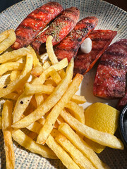 Greek grilled sausages with potato in Crete Island, Greece