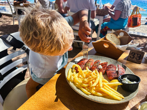 Greek grilled sausages with potato in Crete Island, Greece