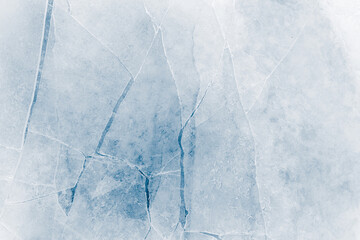 Shards of crushed thin ice in a light-blue tone. Background texture.