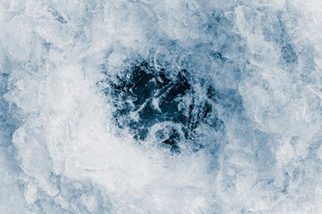 Ice crush on a white background. Chill backdrop. Frame border, made of ice.