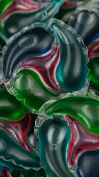 Laundry capsules close up, rotate. Laundry detergent pods. Washing capsules, colorful laundry pods