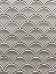 white ceramic tile in the shape of scales, white abstract background