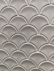 white ceramic tile in the shape of scales, white abstract background