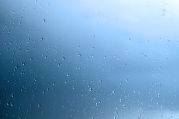 Water drops background, clear water drops on the glass surface, closeup of rain drops on the window