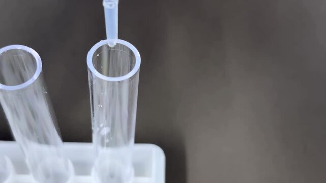 Pipetting liquid into test tube in rack, left composition