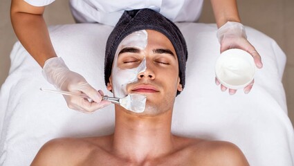 Man receiving professional facial mask treatment at spa skincare clinic.