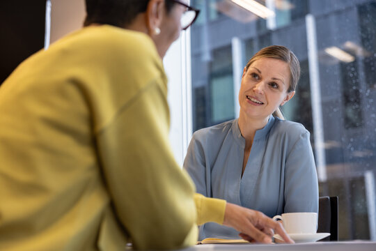 Financial advisor listening to a client in a meeting