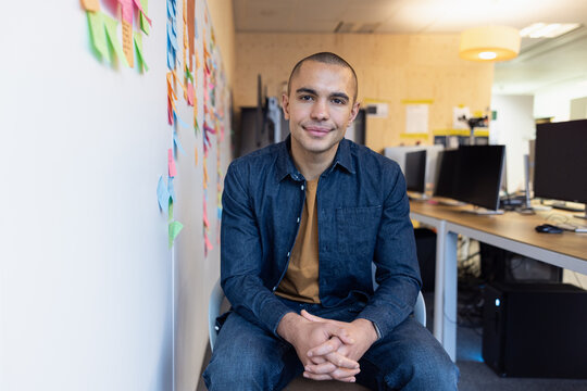Young businessman in Modern Office with sticky notes
