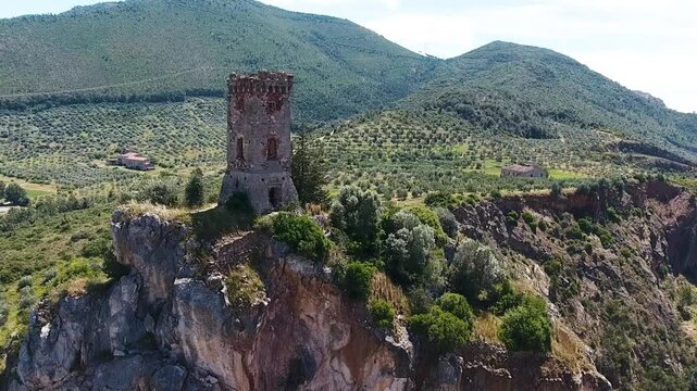 Caprona, Tuscany. Aerial view of famous medieval tower on the mountain top. Slow motion