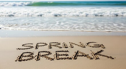 Spring Break Written in Beach Sand.