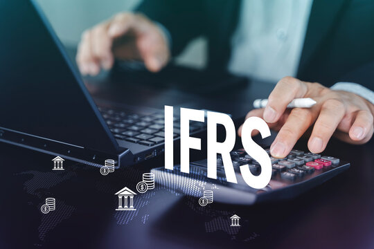IFRS accounting and financial reporting concept with calculator and laptop