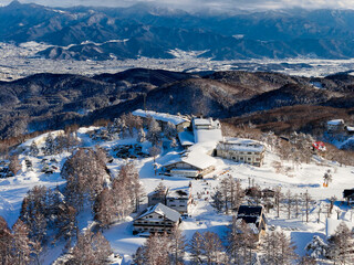 Panoramic landscape of Madarao mountain resort covered in deep snow in Japan
