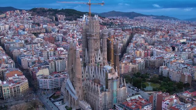 A panoramic aerial view around the east town of the city Barcelona in Spain on an early spring morning. With a fast zoom in.