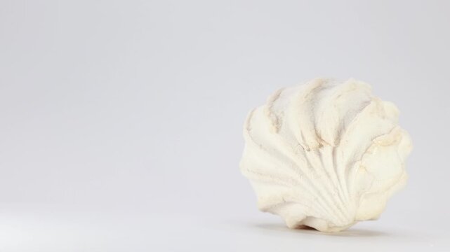 A Slider Shot Moves From Left To Right, Focusing On A Single White Marshmallow Dessert Isolated On A Clean White Background.