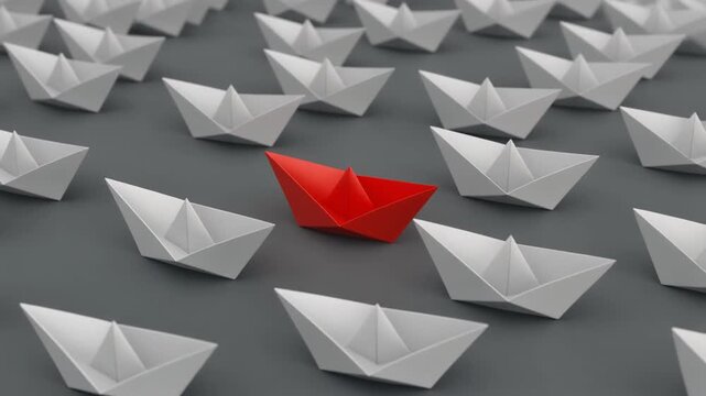 Red Paper Boat Leading a Fleet of White Boats on Grey Surface for Leadership, Innovation, and Standing Out Concept