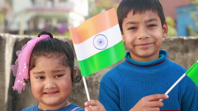 Portrait of Indian children holding national flags outdoors symbolizing patriotism unity childhood innocence national pride cultural identity and celebration