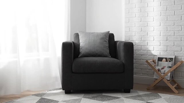 Dark armchair with pillow.